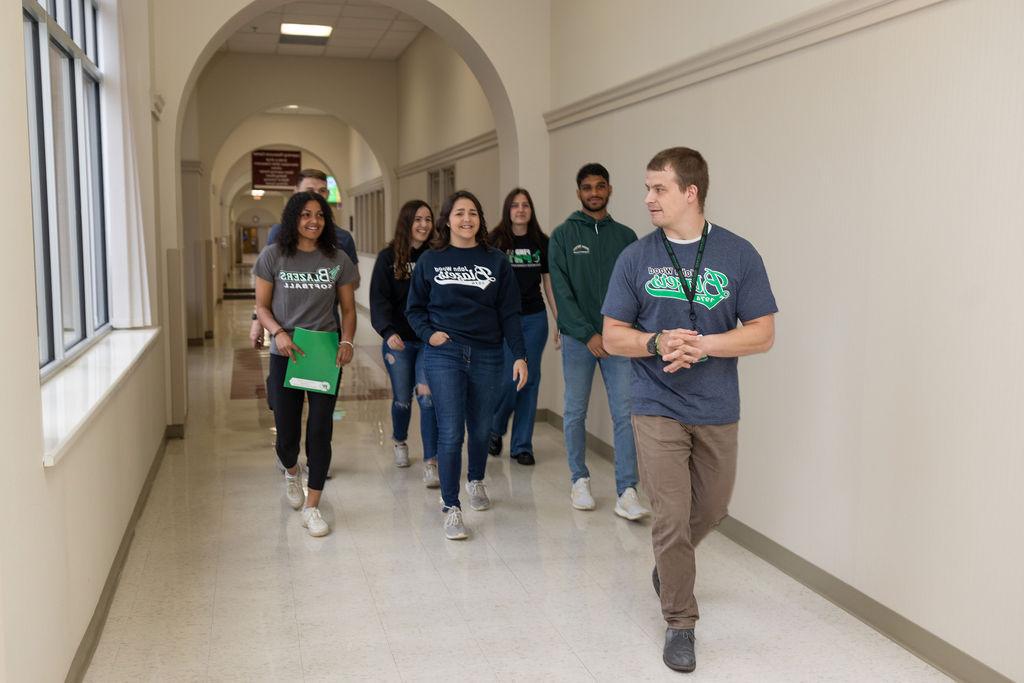 Admissions Representative leads JWCC Students Down The Hall